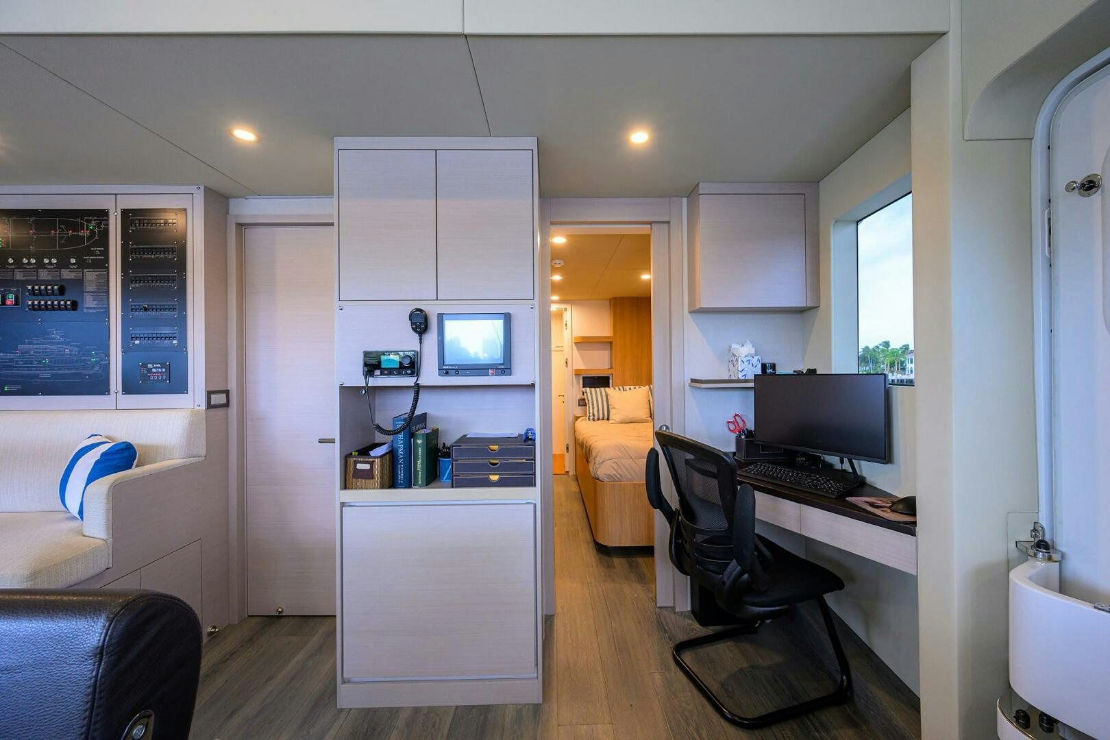a room with a desk and a computer aboard AMORE Yacht for Sale