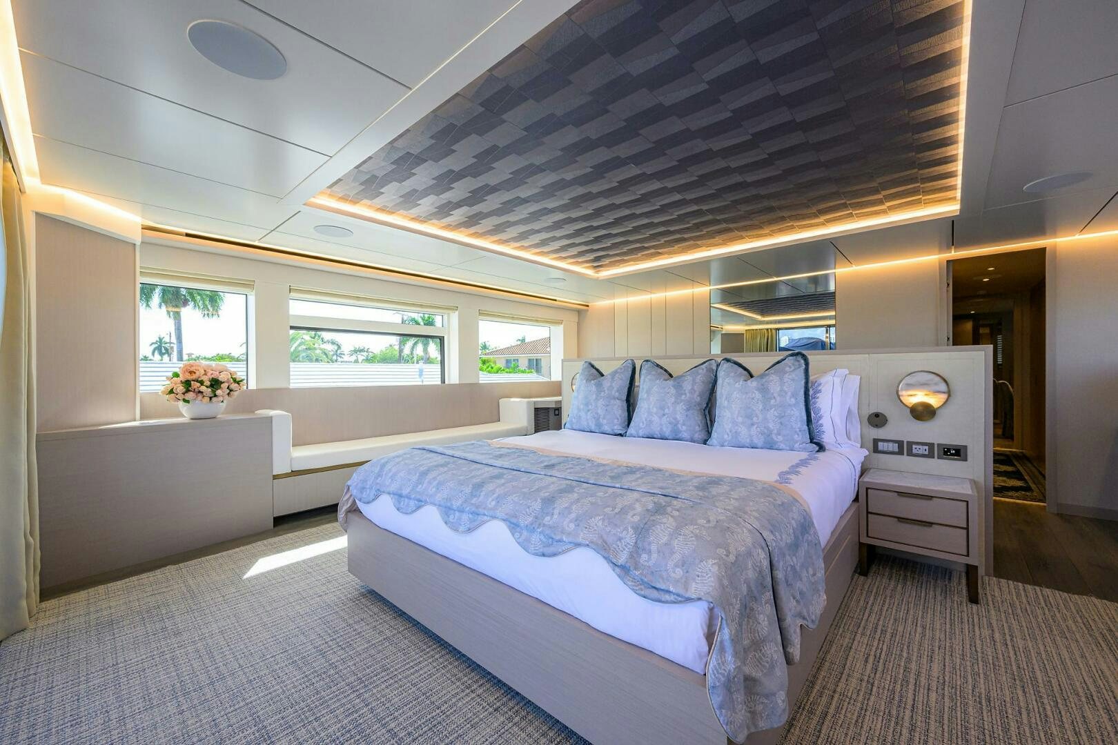 a bedroom with a bed and a window aboard AMORE Yacht for Sale