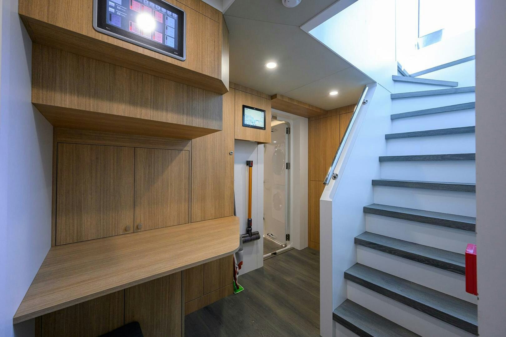 a staircase with a wood railing aboard AMORE Yacht for Sale