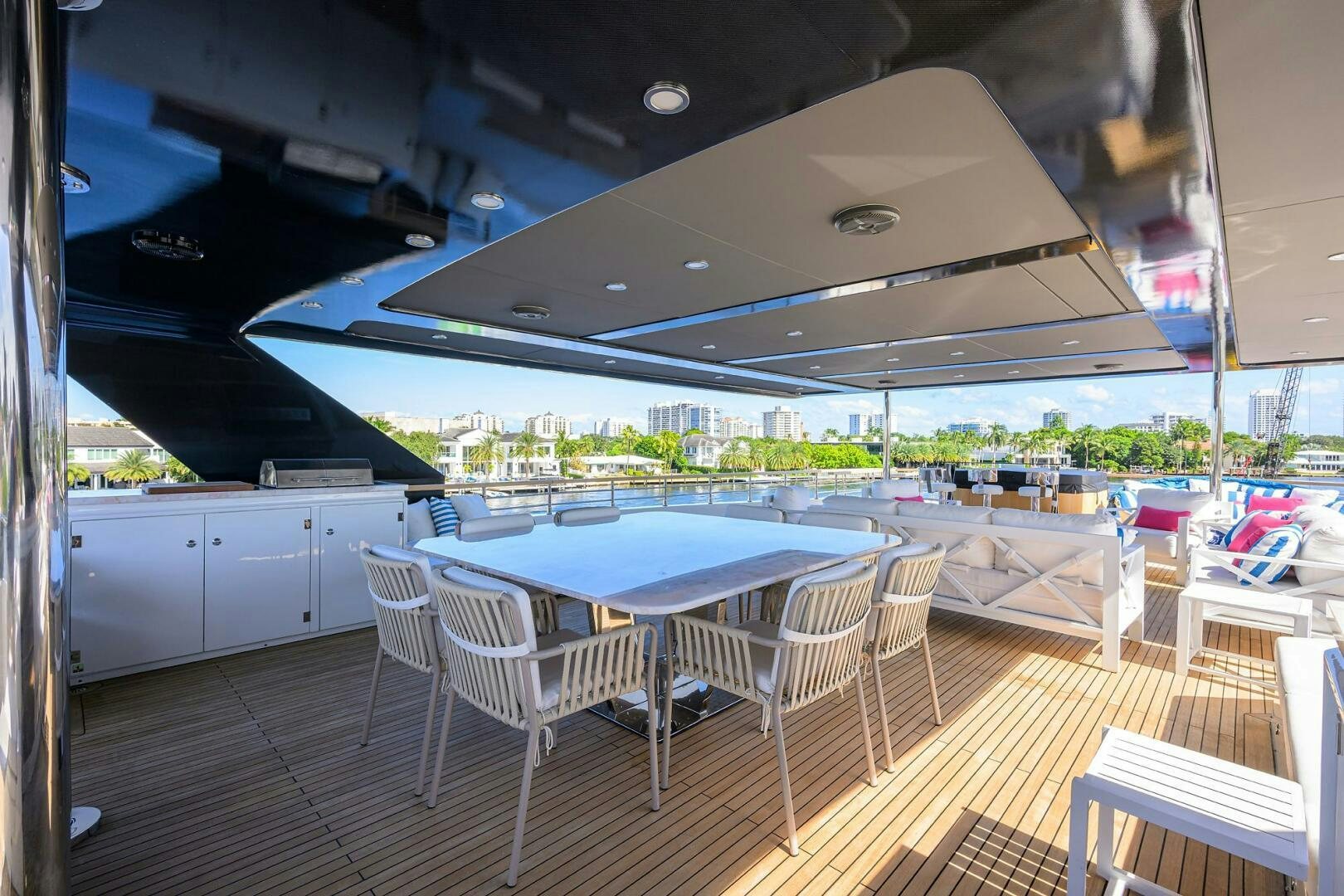 a room with a table and chairs aboard AMORE Yacht for Sale