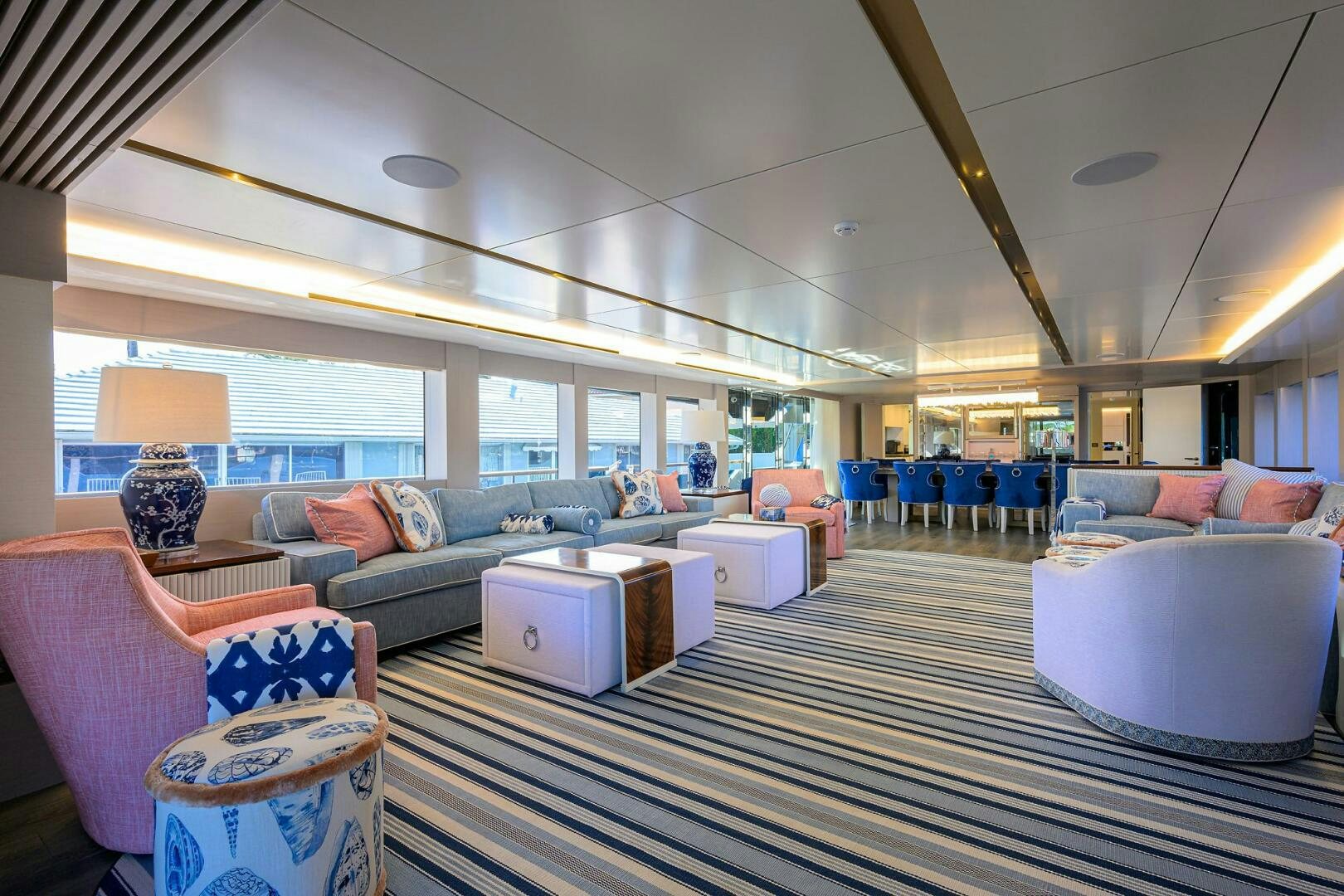a large living room with a large open floor plan aboard AMORE Yacht for Sale