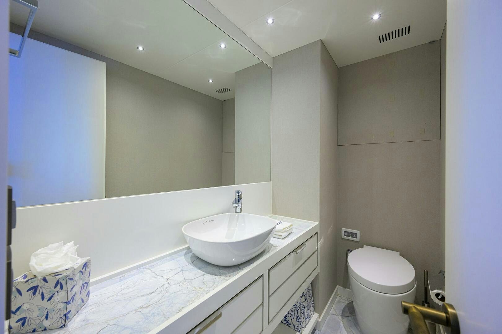 a bathroom with a large mirror aboard AMORE Yacht for Sale