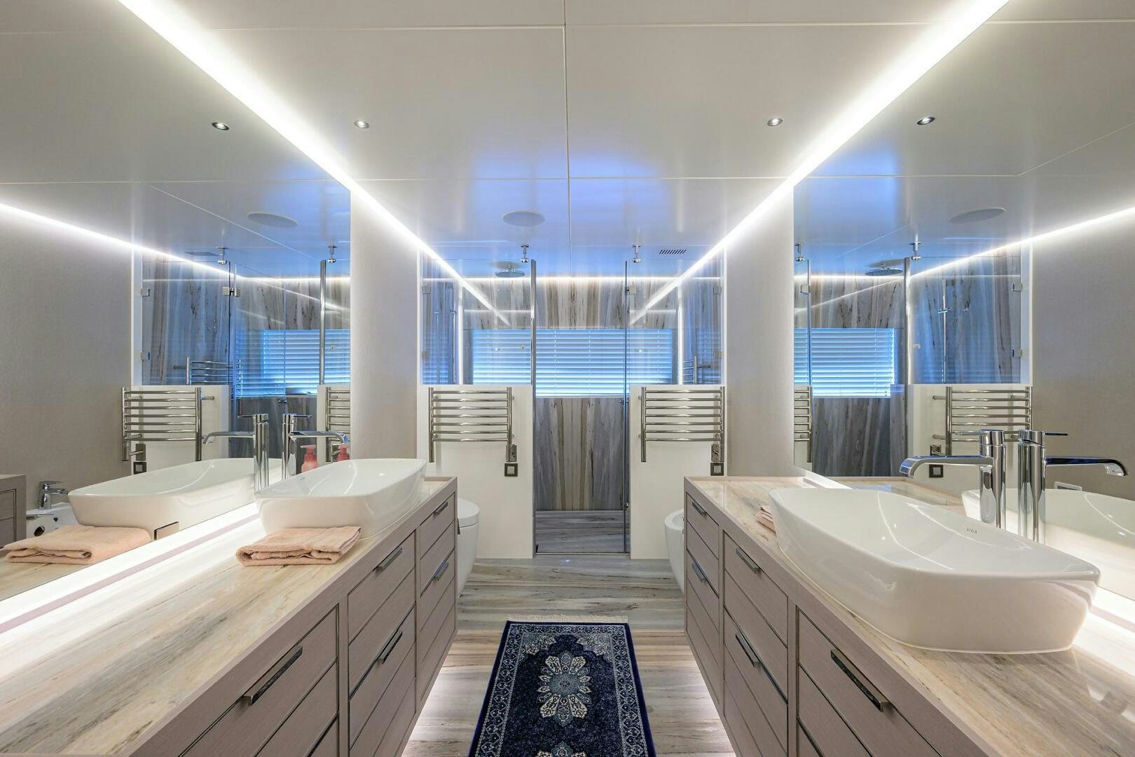 a bathroom with a large mirror aboard AMORE Yacht for Sale