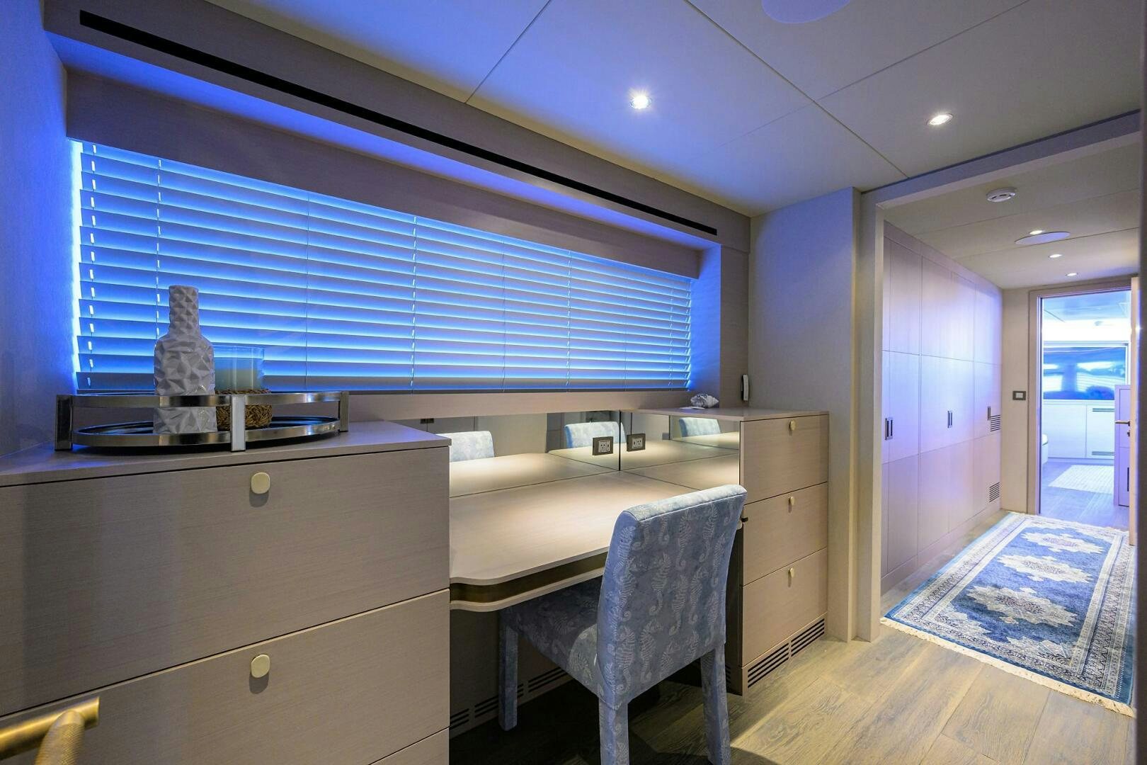 a room with a bed and a desk aboard AMORE Yacht for Sale
