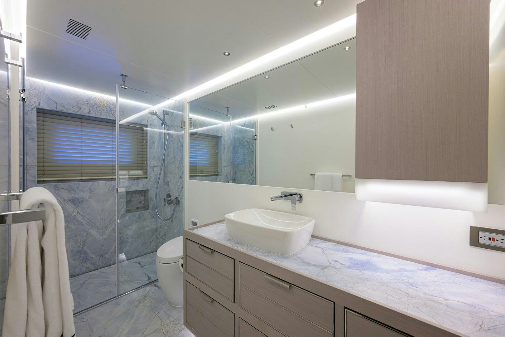 a bathroom with a sink and a mirror aboard AMORE Yacht for Sale