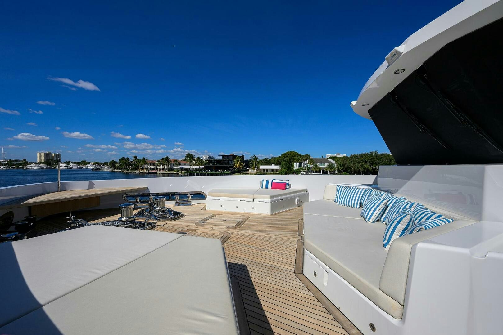 a deck with beds on it aboard AMORE Yacht for Sale