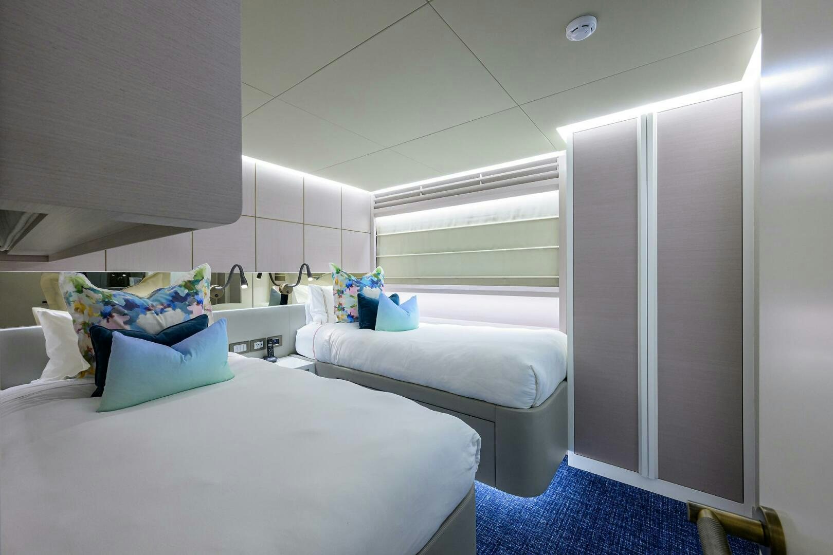 a room with a bed and a desk aboard AMORE Yacht for Sale