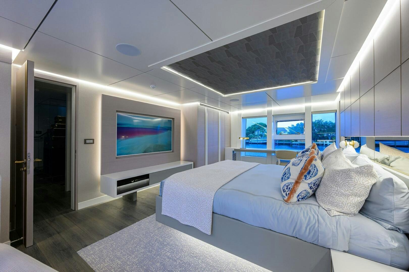 a room with a bed and a television aboard AMORE Yacht for Sale