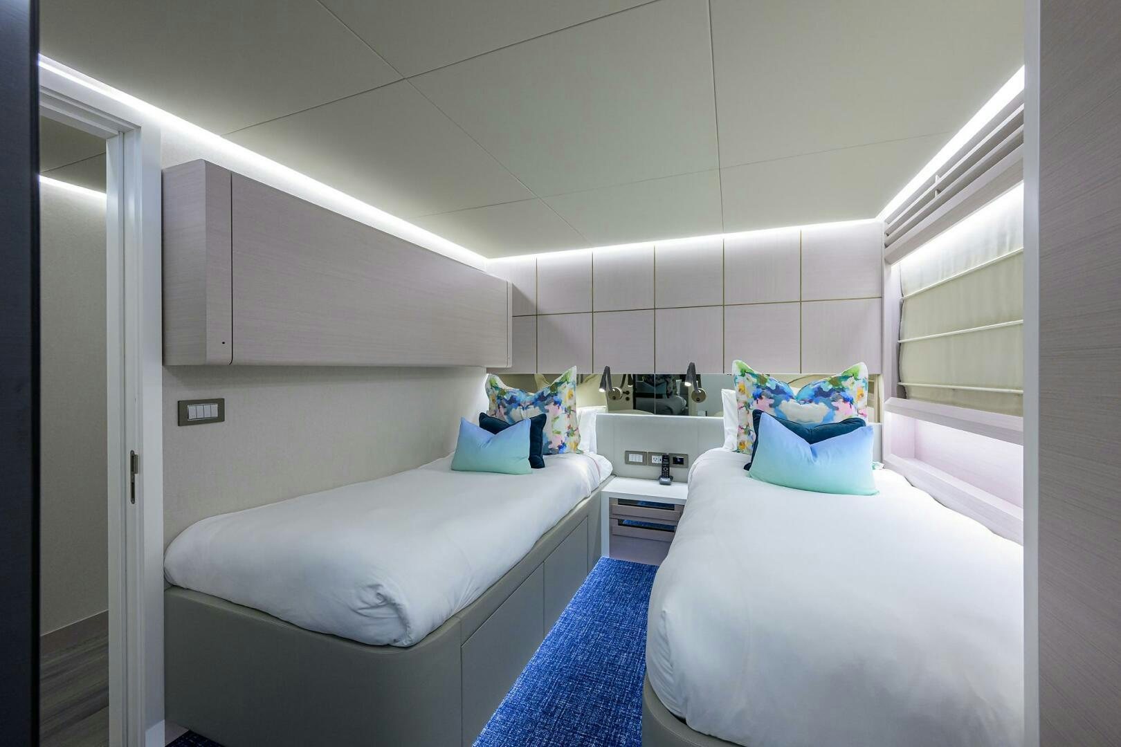 a room with two beds aboard AMORE Yacht for Sale