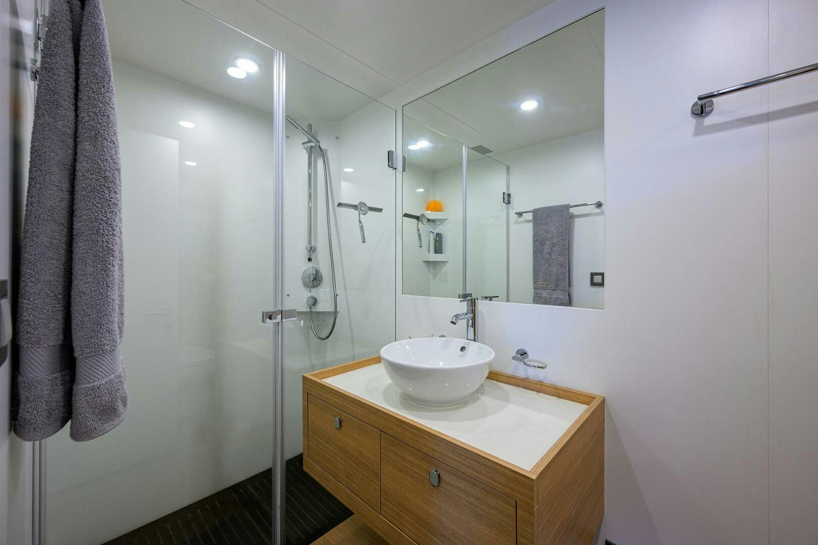 a bathroom with a sink and a shower aboard AMORE Yacht for Sale