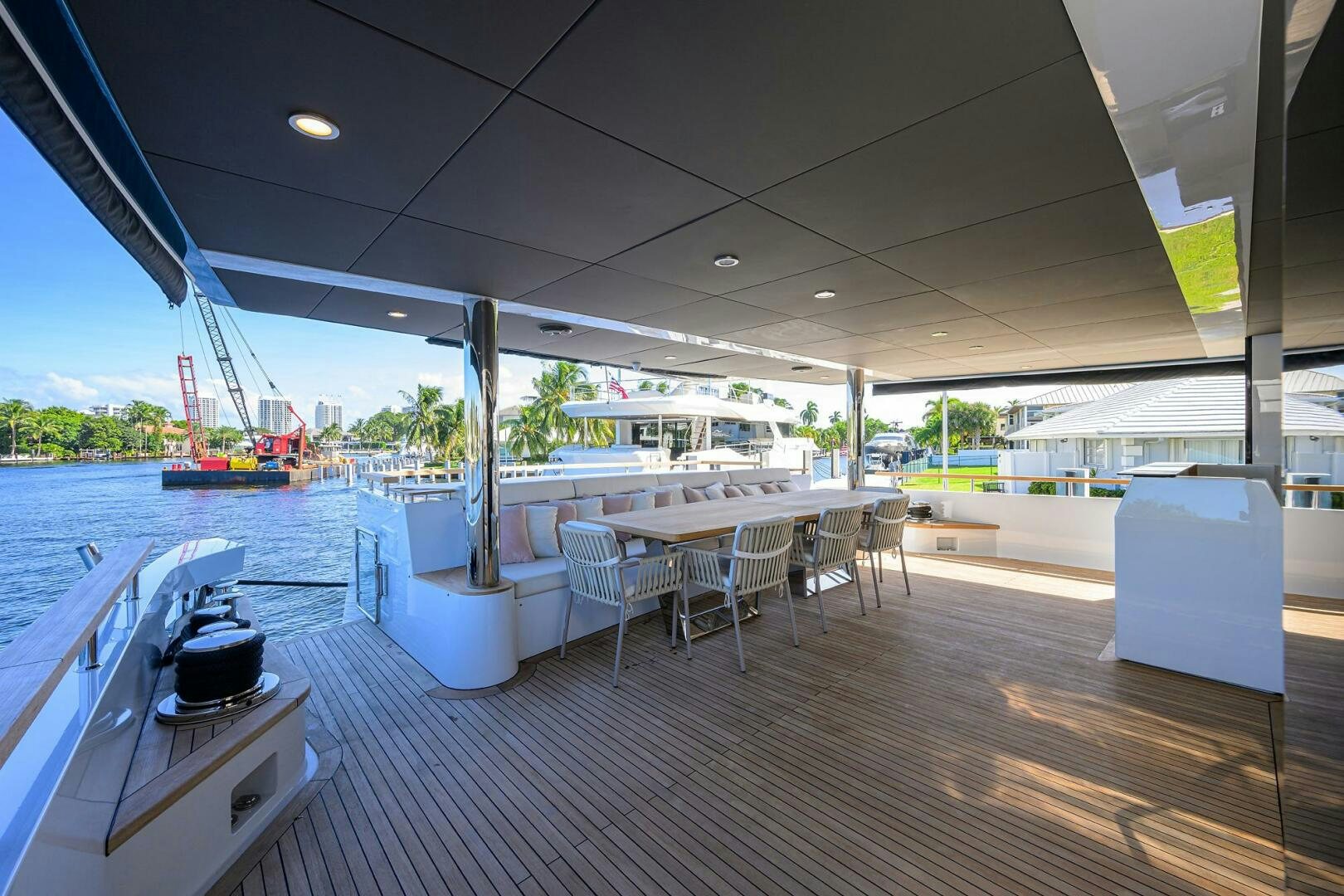 a boat dock with tables and chairs aboard AMORE Yacht for Sale