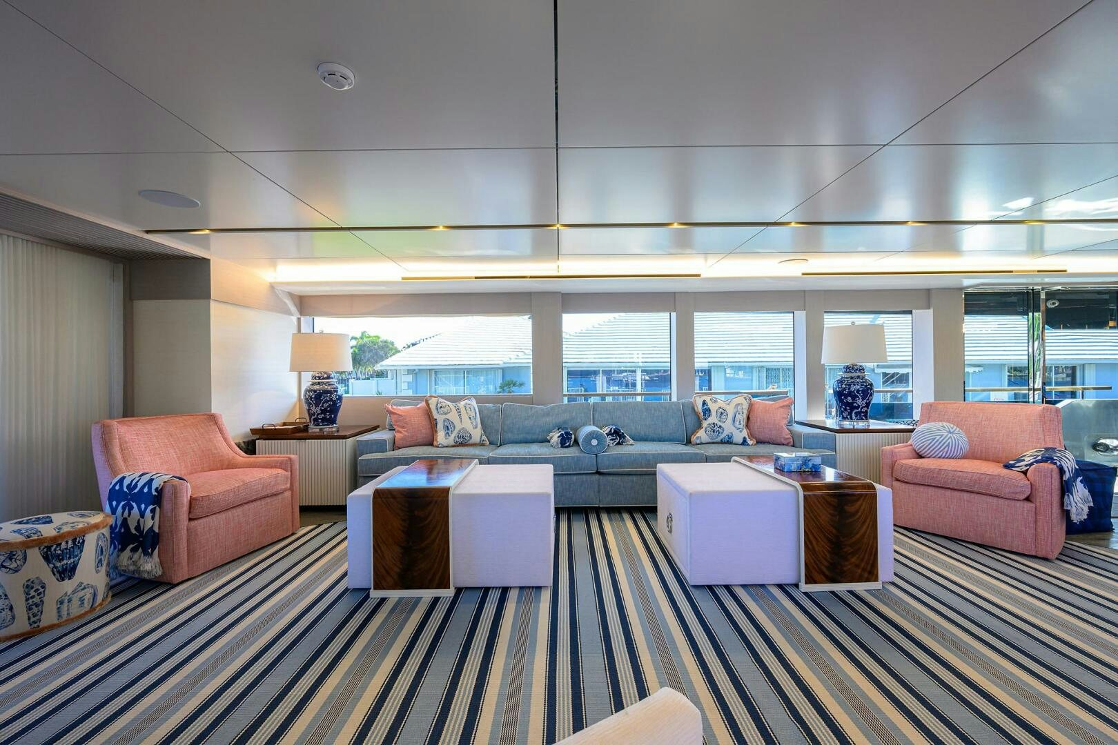 a large living room with a large window aboard AMORE Yacht for Sale
