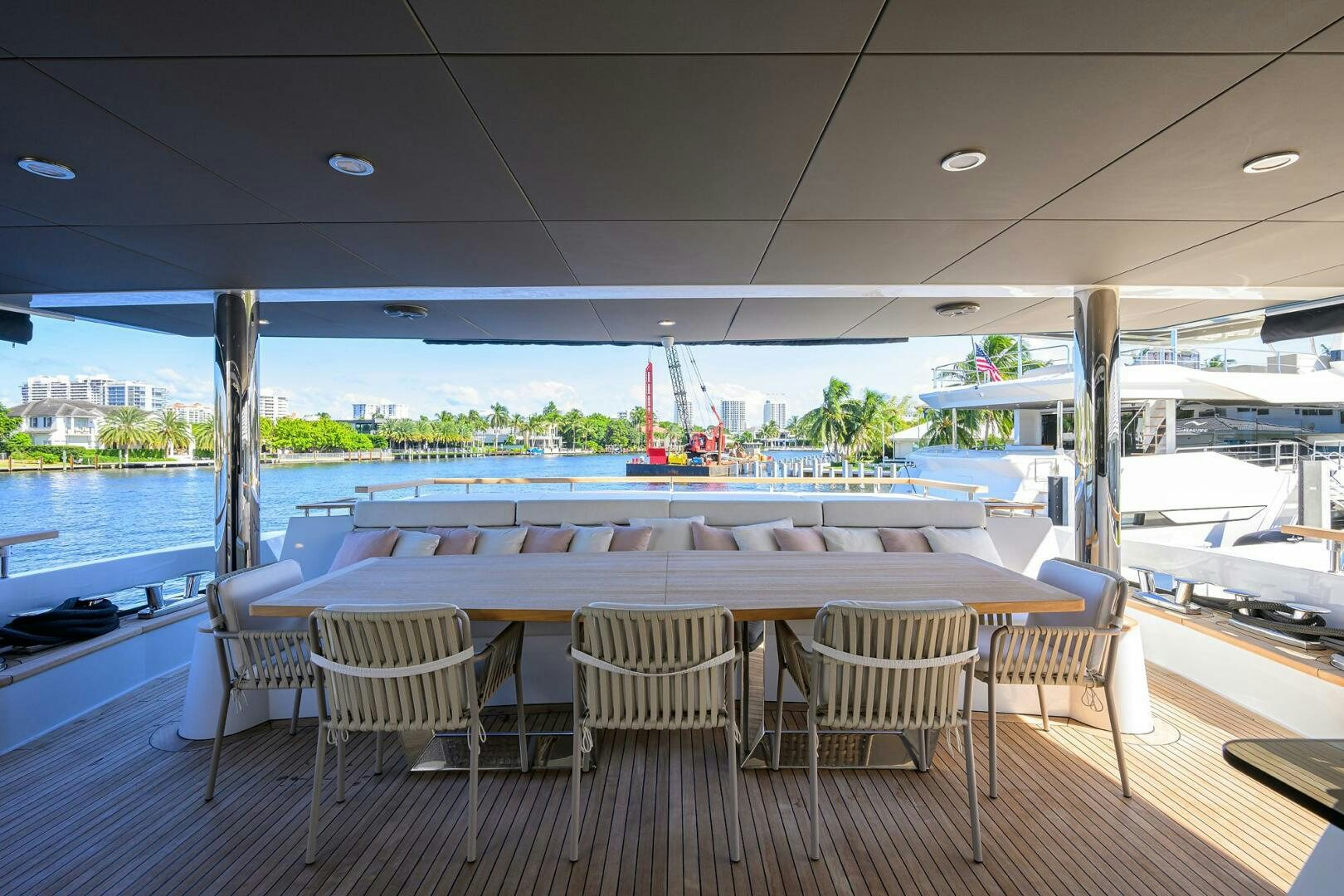 a table and chairs on a deck aboard AMORE Yacht for Sale