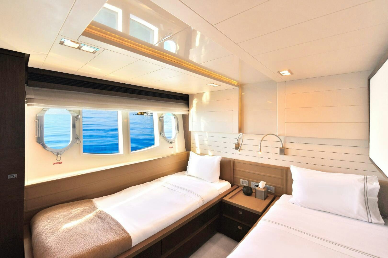 a room with two beds aboard INFINITAS Yacht for Sale