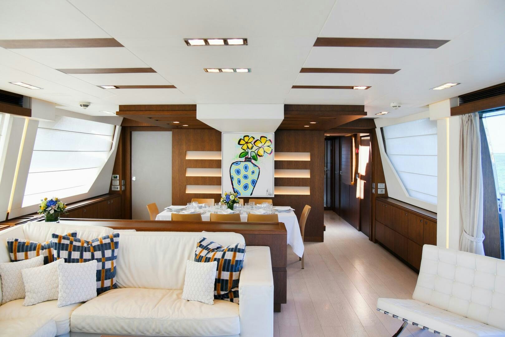 a living room with a couch and a table aboard INFINITAS Yacht for Sale