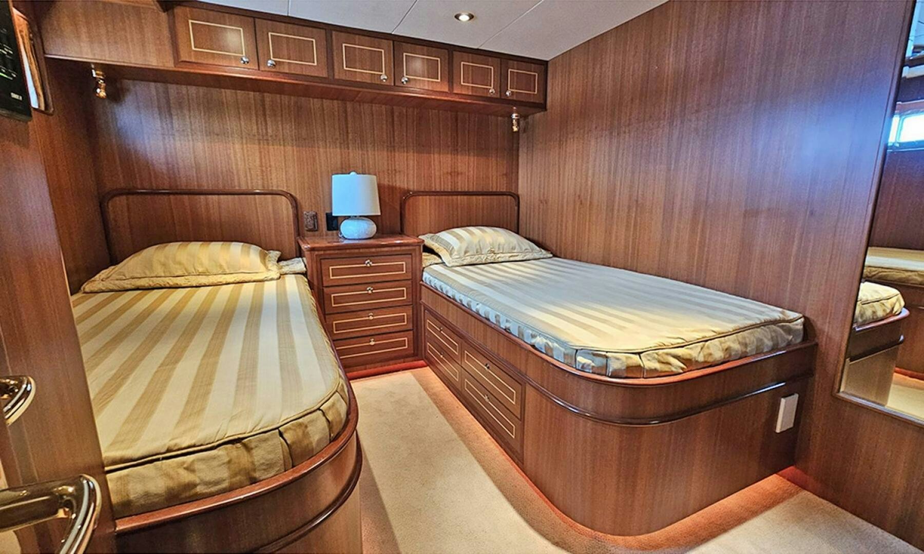 a couple of beds in a room aboard SHAMROCK Yacht for Sale
