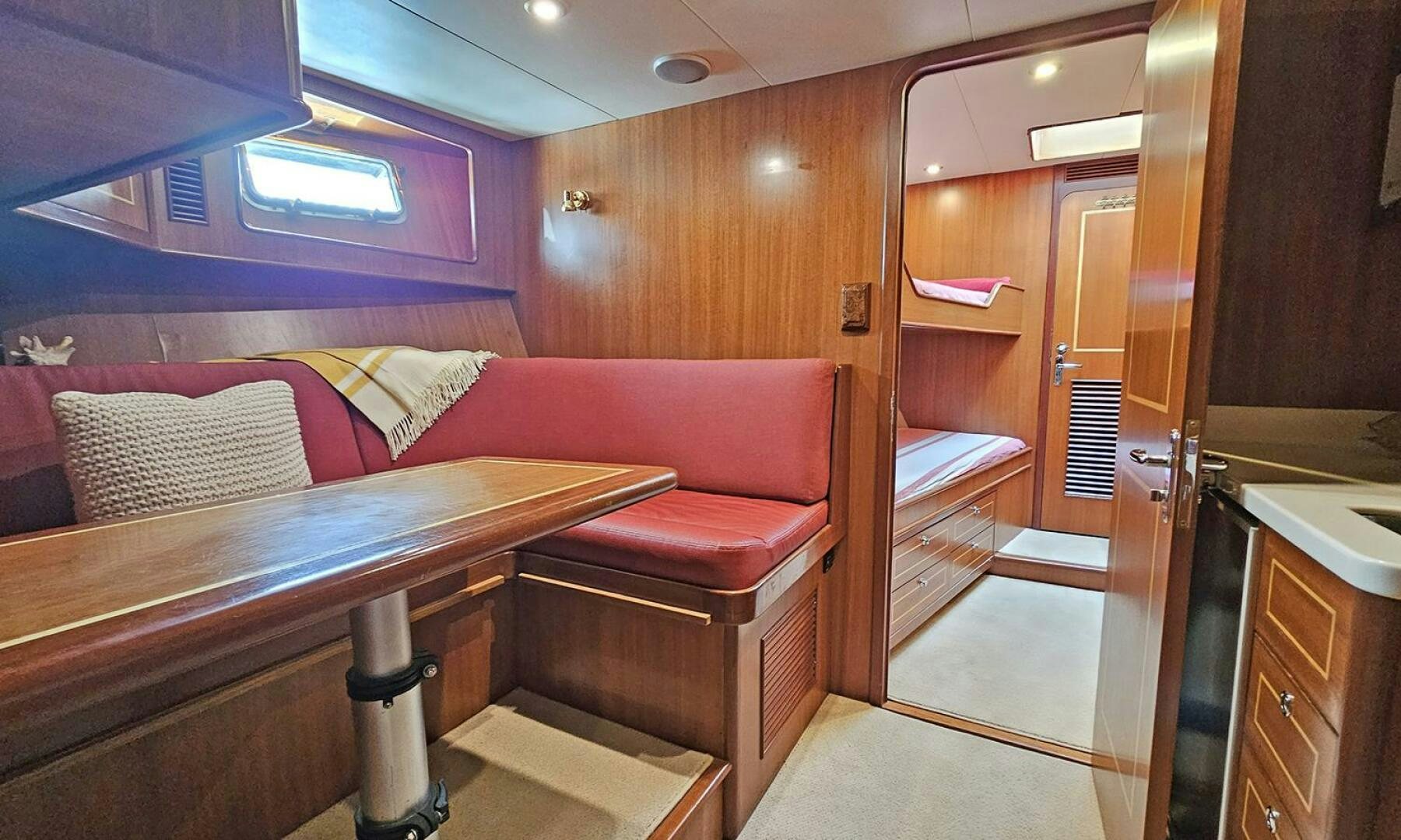 a room with a bed and a couch aboard SHAMROCK Yacht for Sale