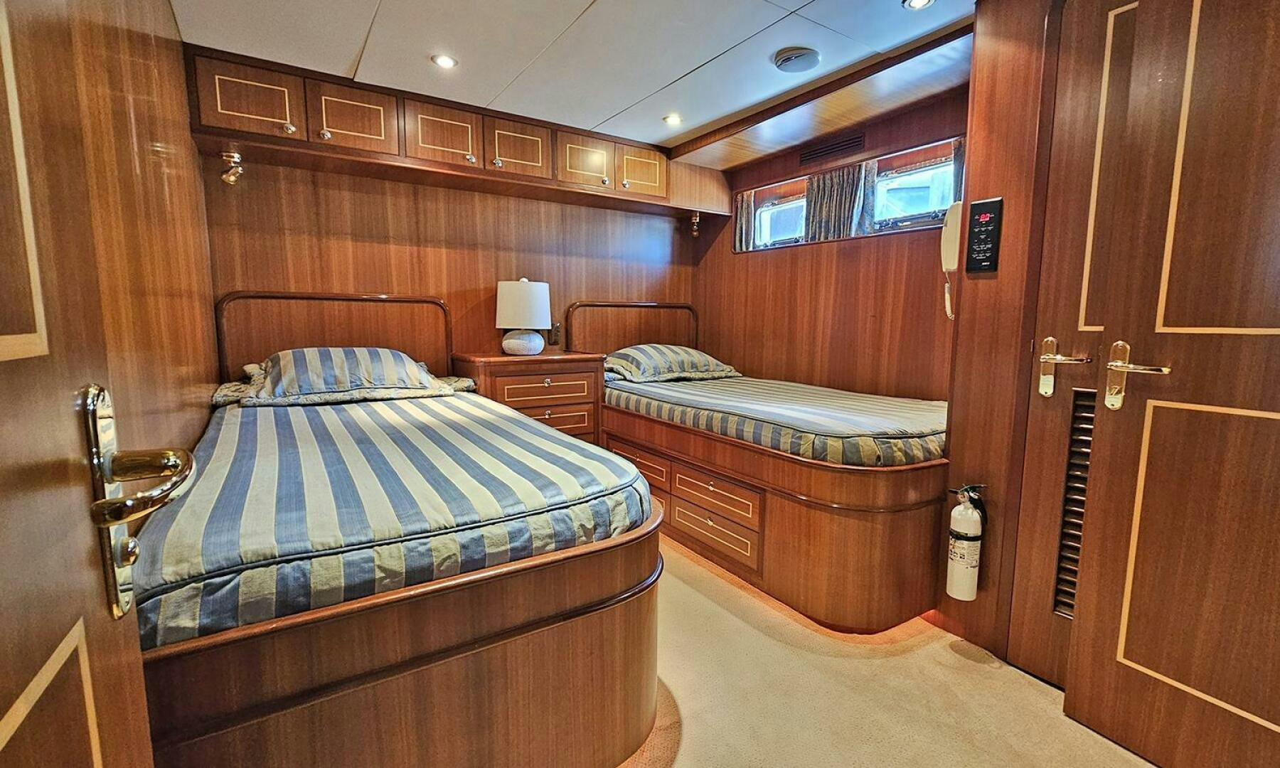 a couple of beds in a room aboard SHAMROCK Yacht for Sale