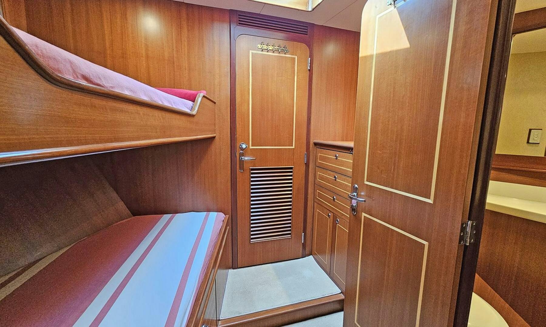 a room with a bed and a closet aboard SHAMROCK Yacht for Sale