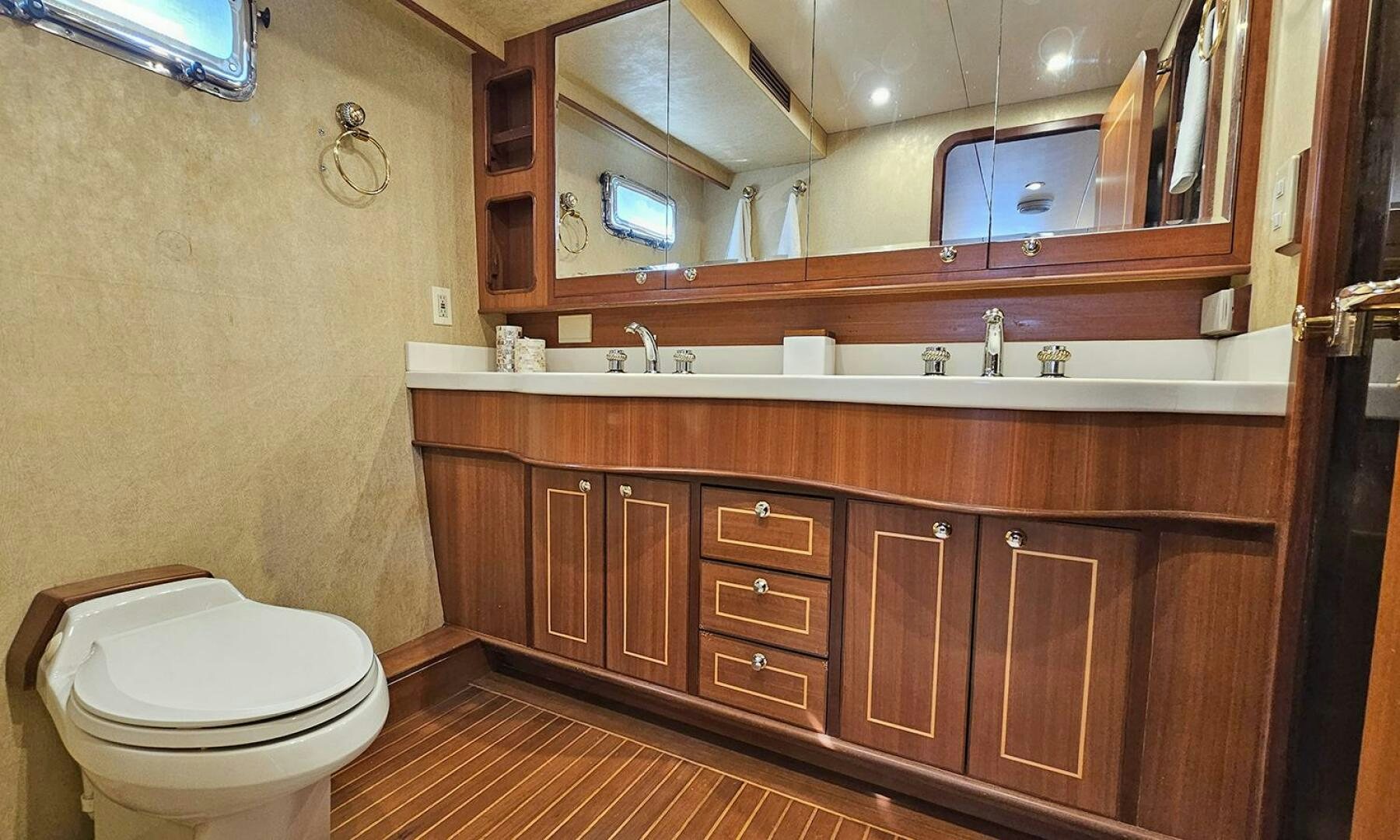 a bathroom with a toilet and a sink aboard SHAMROCK Yacht for Sale