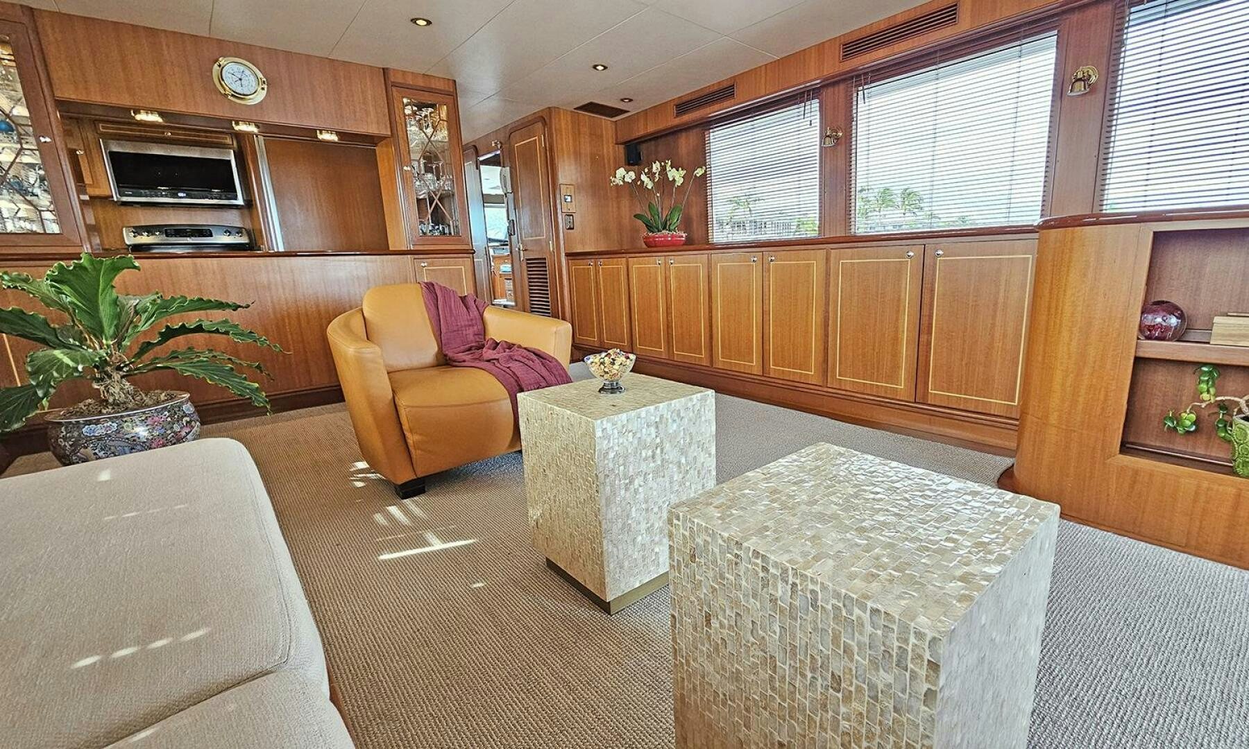 a living room with a couch and a table aboard SHAMROCK Yacht for Sale