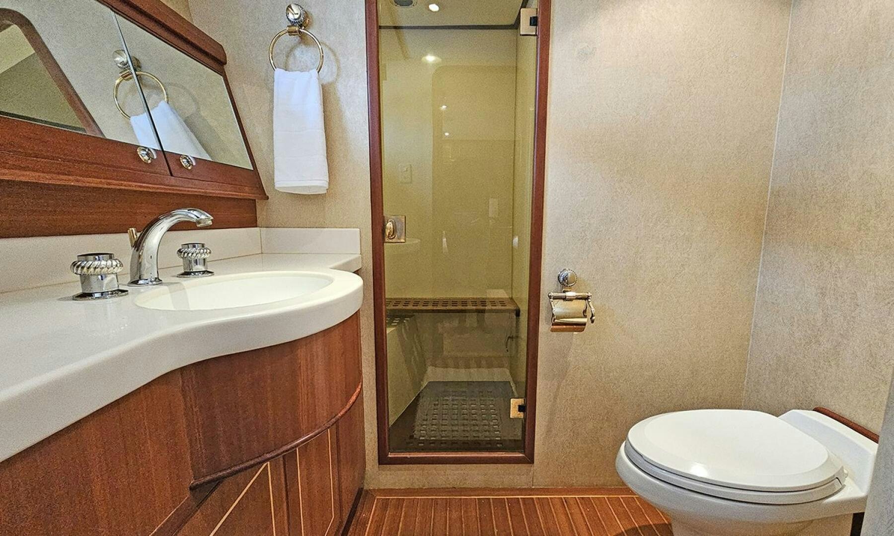 a bathroom with a glass shower door aboard SHAMROCK Yacht for Sale
