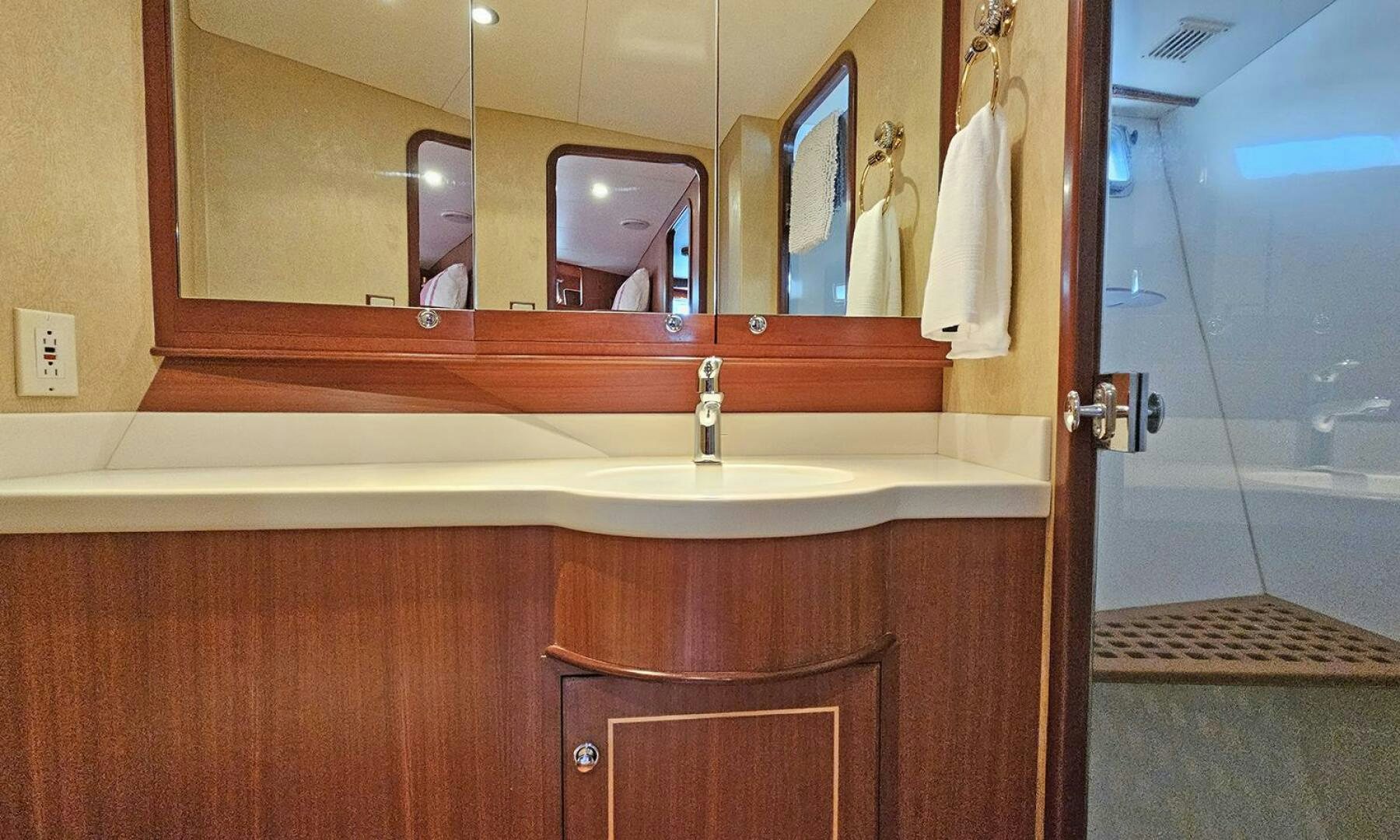 a bathroom with a sink and a mirror aboard SHAMROCK Yacht for Sale
