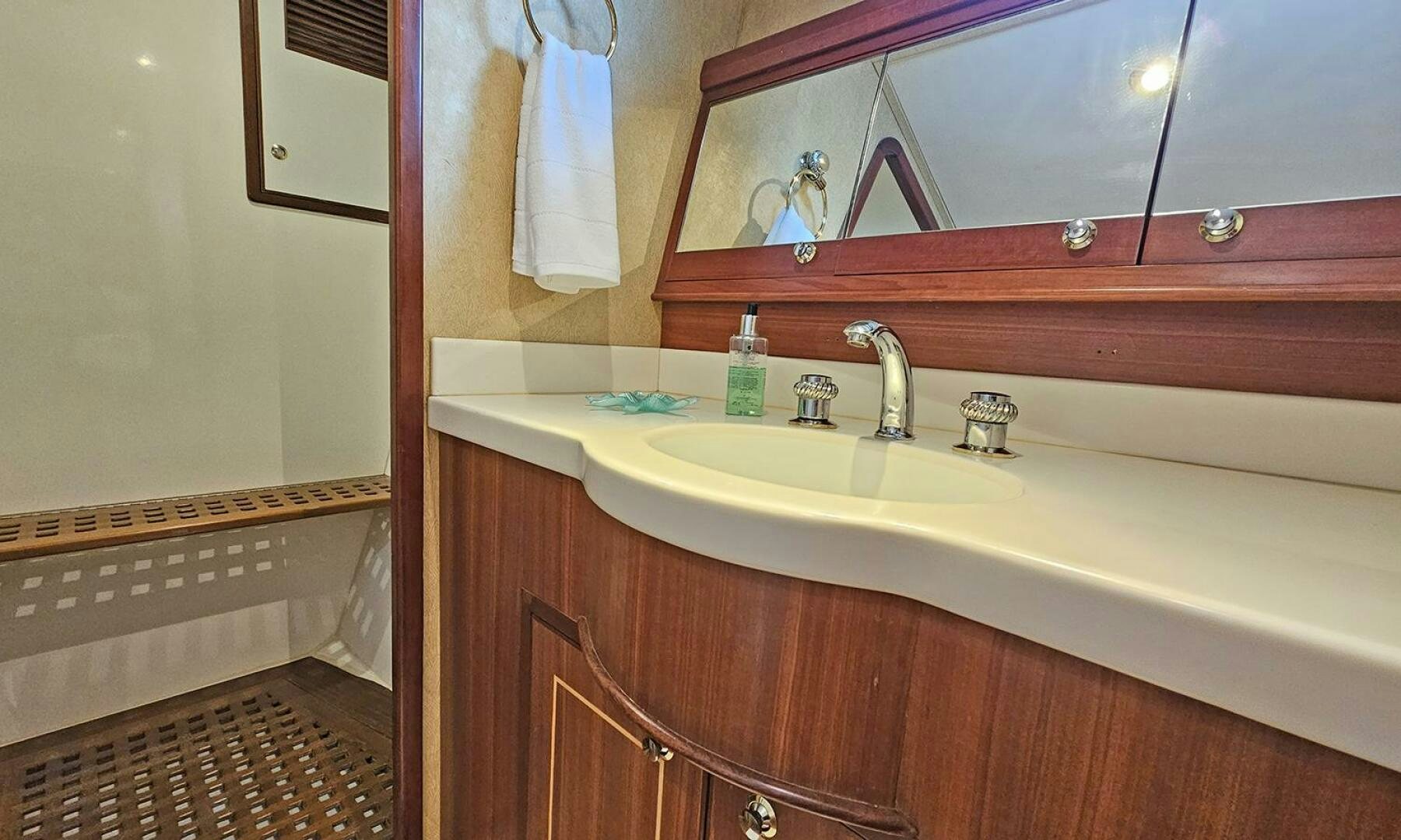 a bathroom with a sink and a mirror aboard SHAMROCK Yacht for Sale