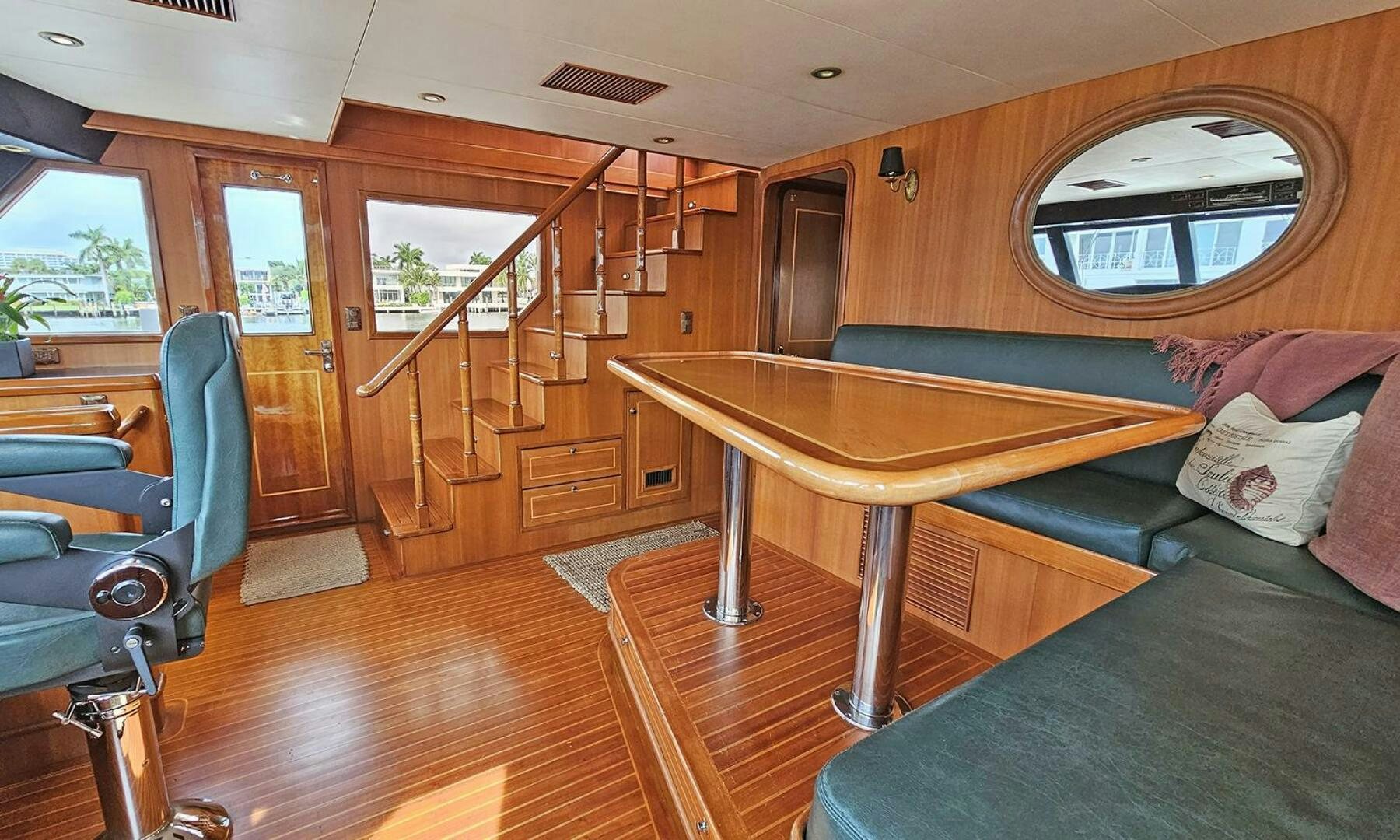 a living room with a wood table aboard SHAMROCK Yacht for Sale