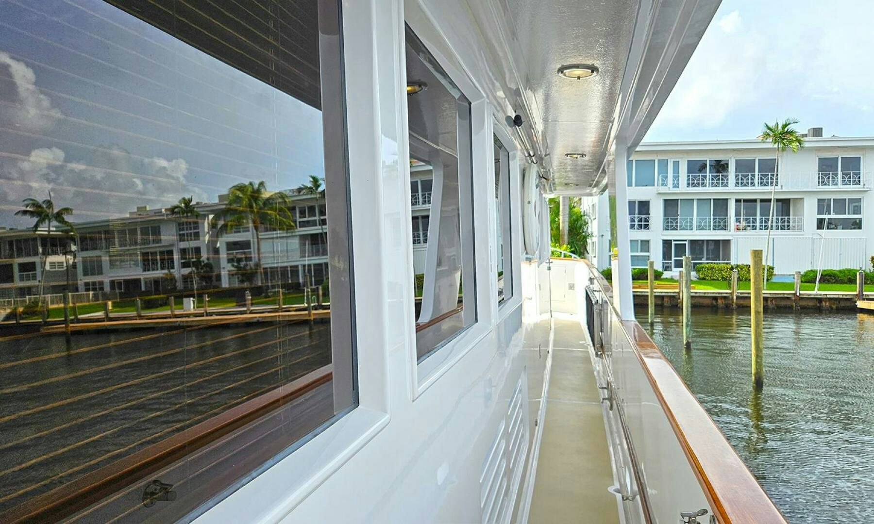 a balcony with a body of water and buildings in the background aboard SHAMROCK Yacht for Sale