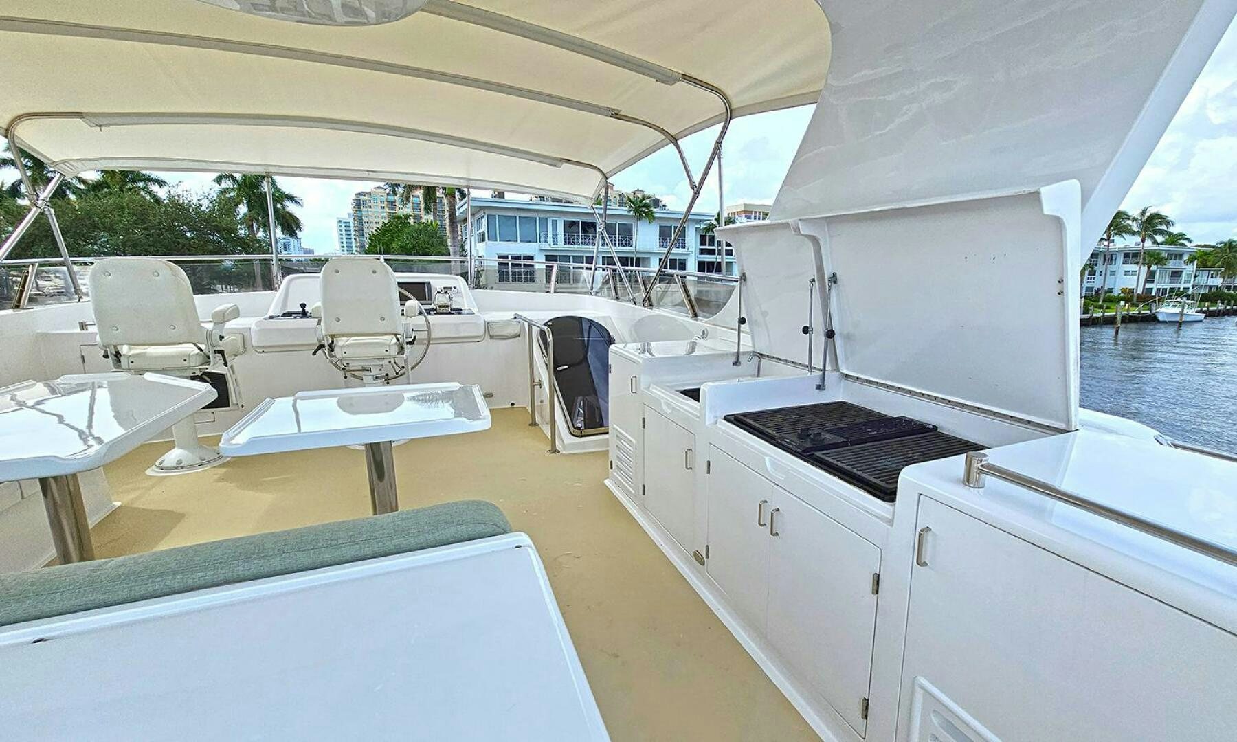 a boat with a table and chairs aboard SHAMROCK Yacht for Sale