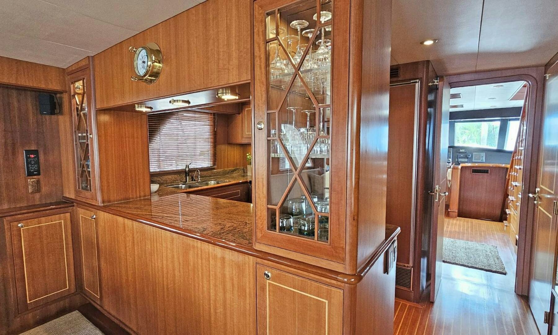 a kitchen with wooden cabinets aboard SHAMROCK Yacht for Sale