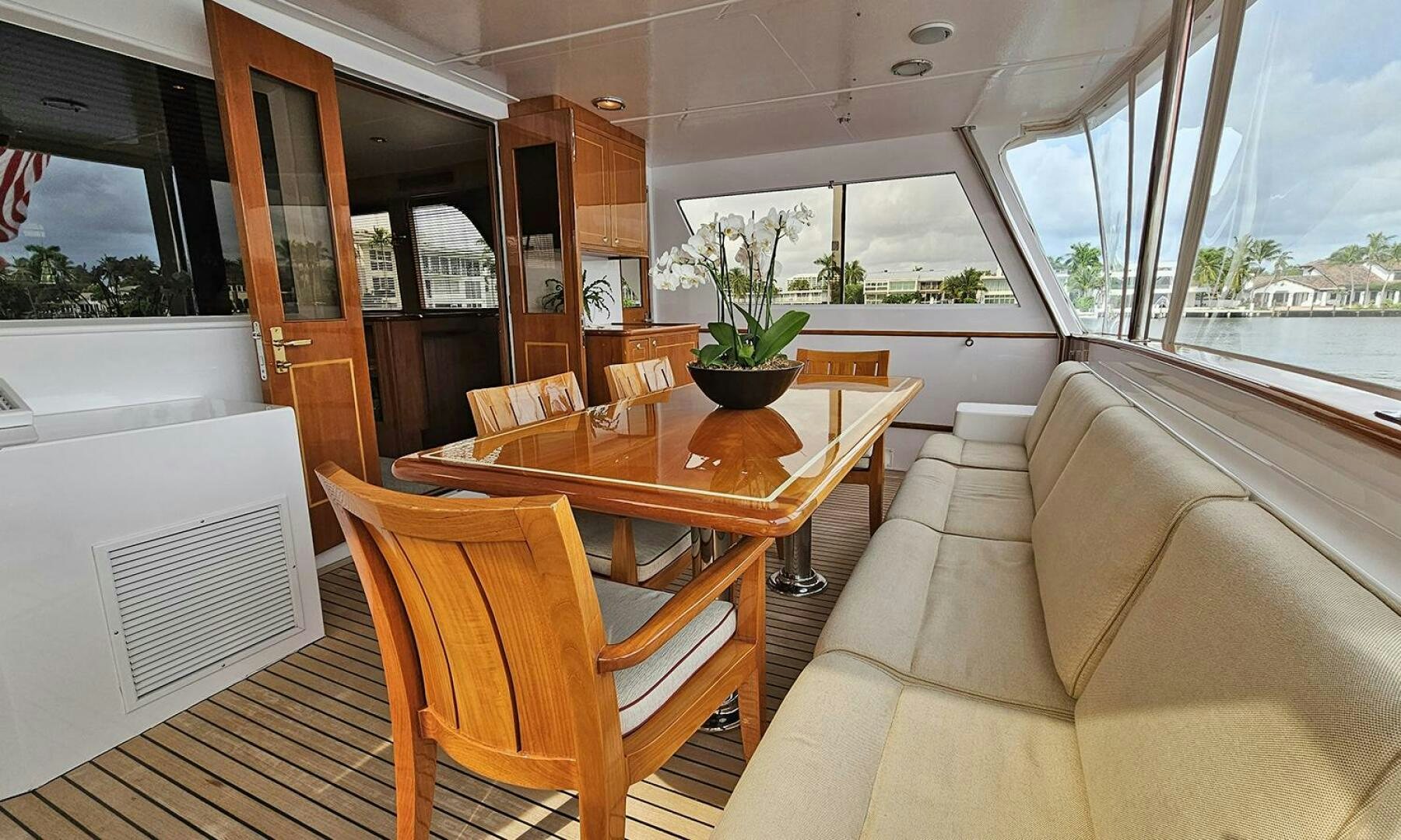 a living room with a table and chairs aboard SHAMROCK Yacht for Sale