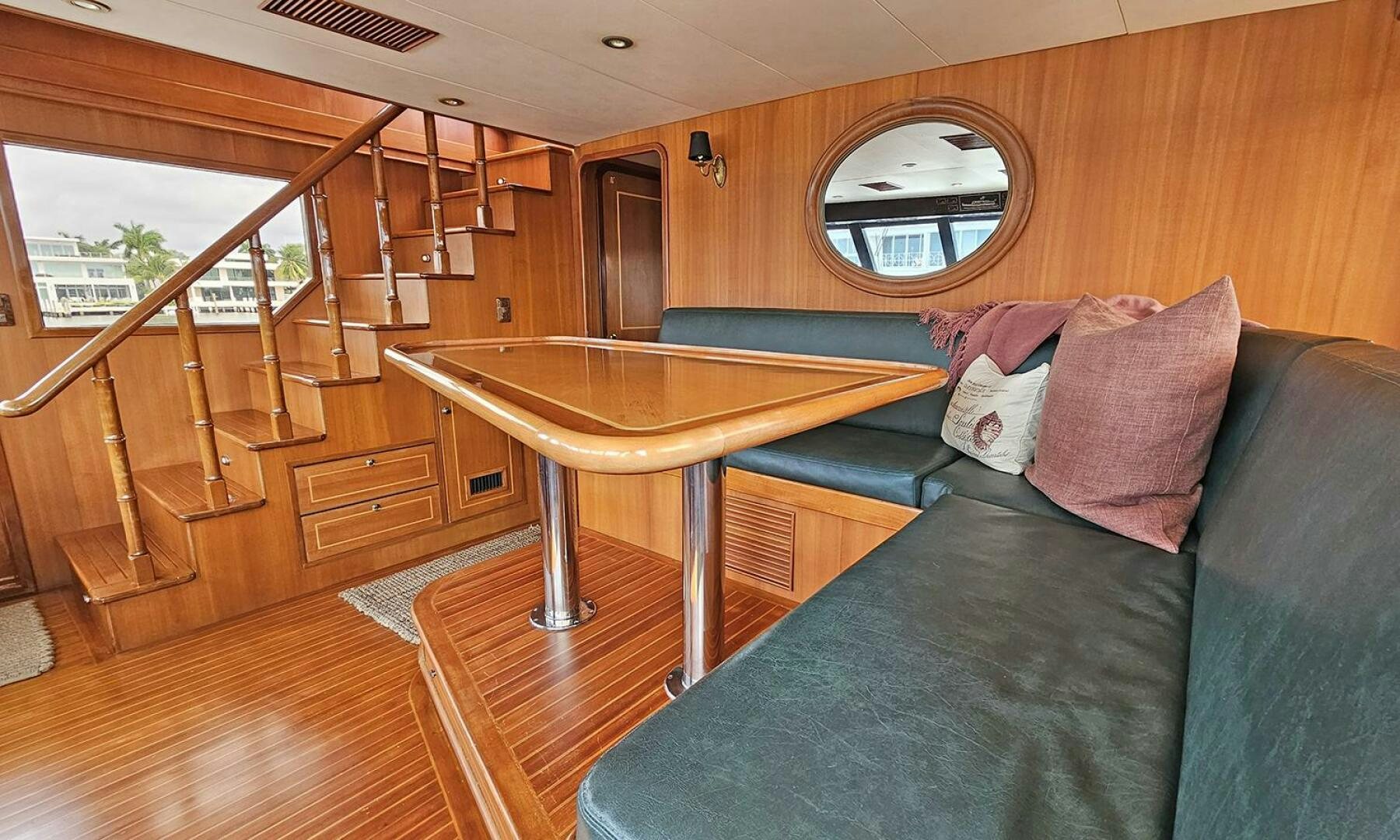a living room with a couch and a table aboard SHAMROCK Yacht for Sale