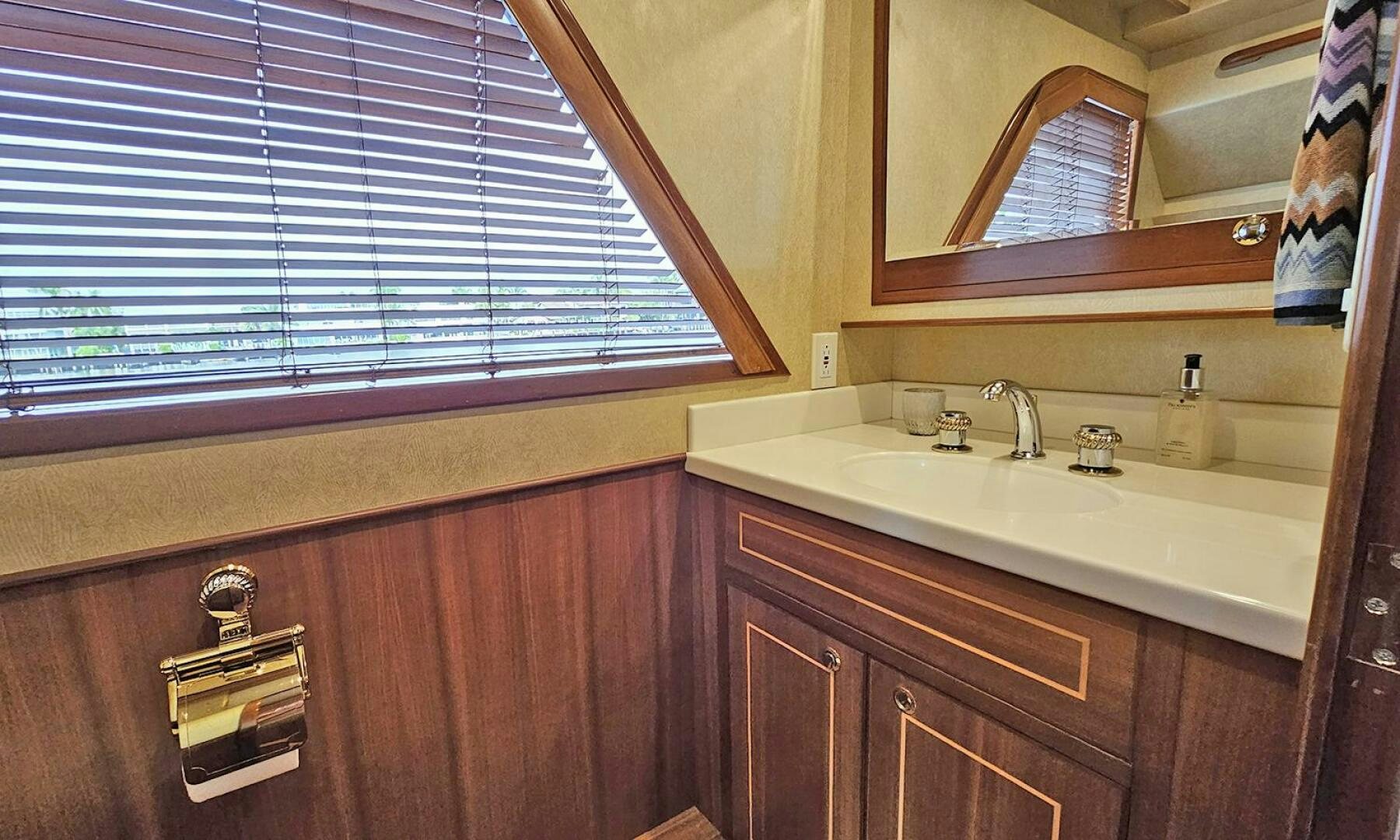a bathroom with a sink and a mirror aboard SHAMROCK Yacht for Sale