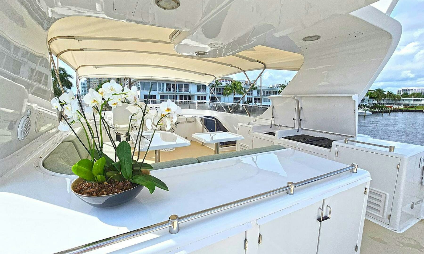 a white kitchen with a plant on the counter aboard SHAMROCK Yacht for Sale