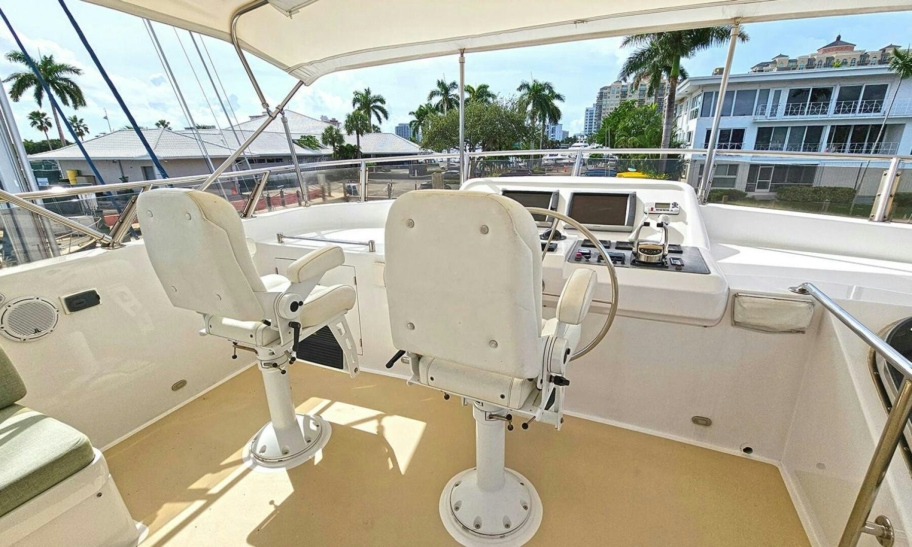 a white boat on a deck aboard SHAMROCK Yacht for Sale