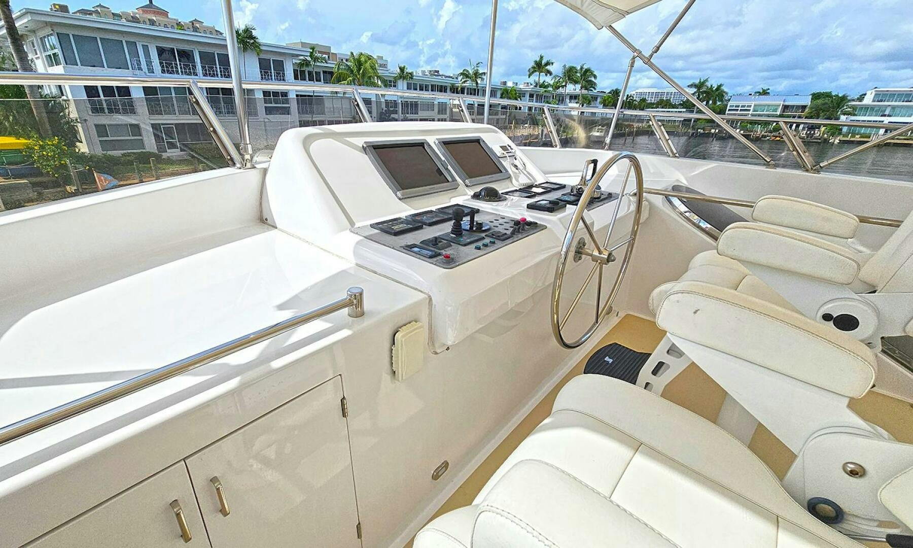 a white boat on a deck aboard SHAMROCK Yacht for Sale