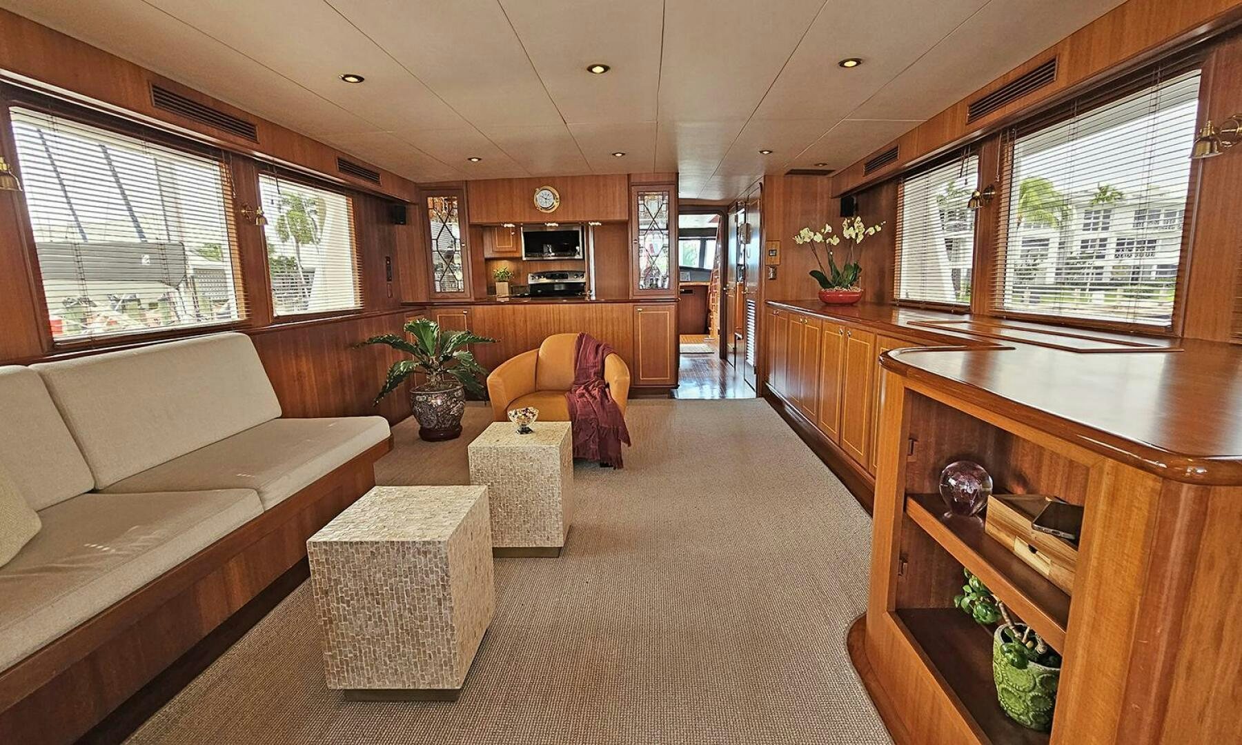a living room with a couch and a coffee table aboard SHAMROCK Yacht for Sale
