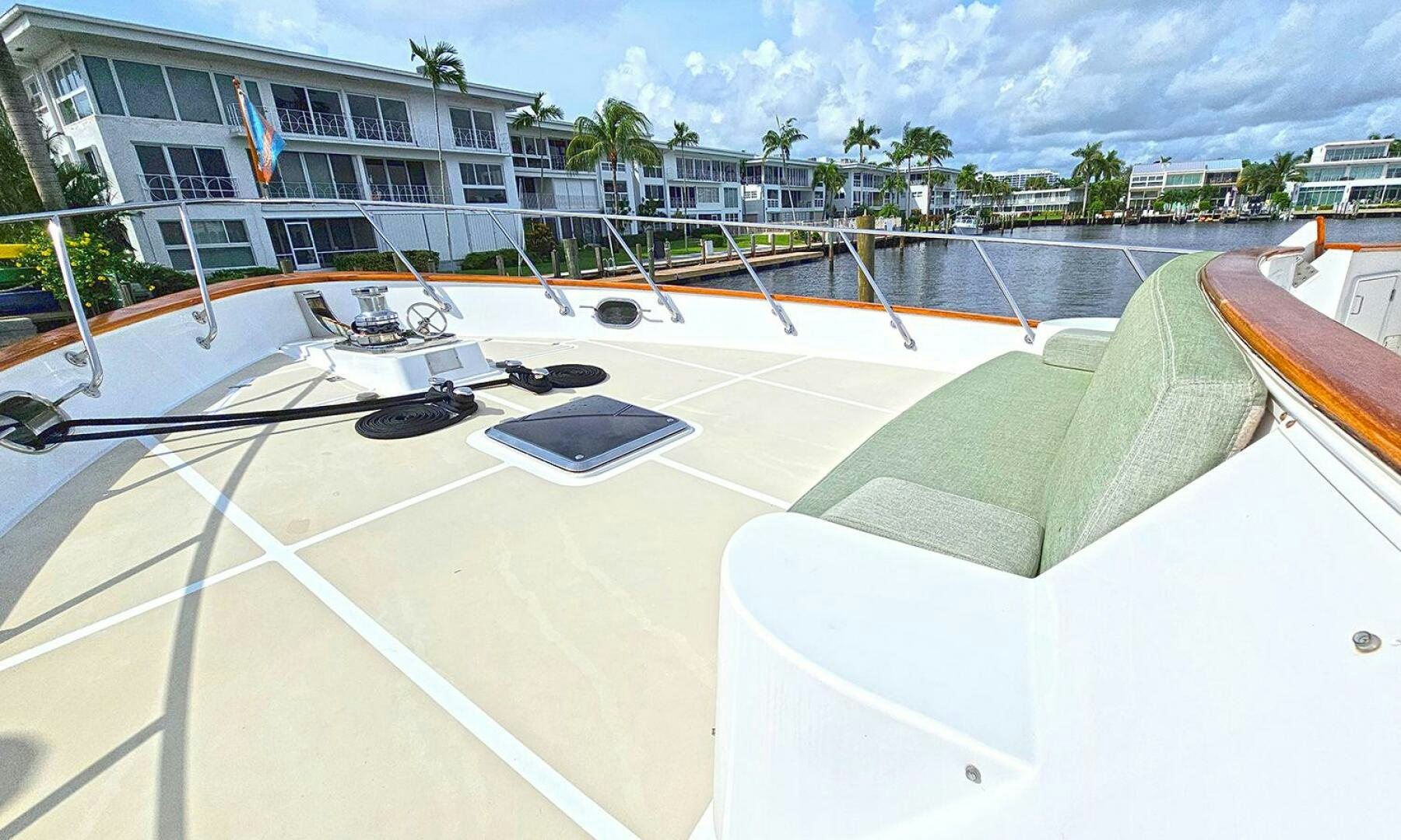 a pool with a deck and a building in the background aboard SHAMROCK Yacht for Sale
