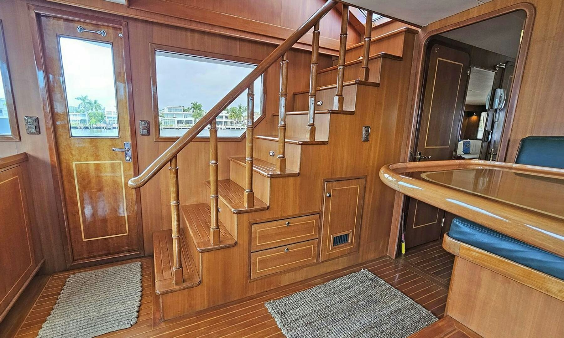 a bathroom with a tub and a wood door aboard SHAMROCK Yacht for Sale