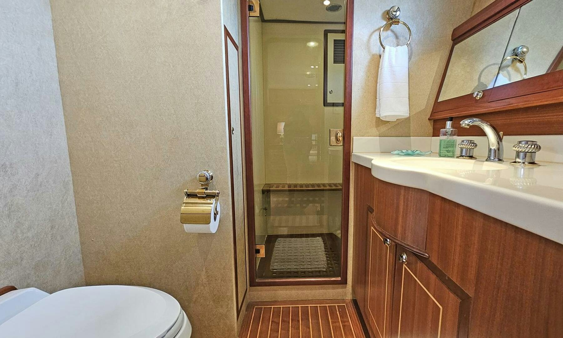 a bathroom with a glass door aboard SHAMROCK Yacht for Sale