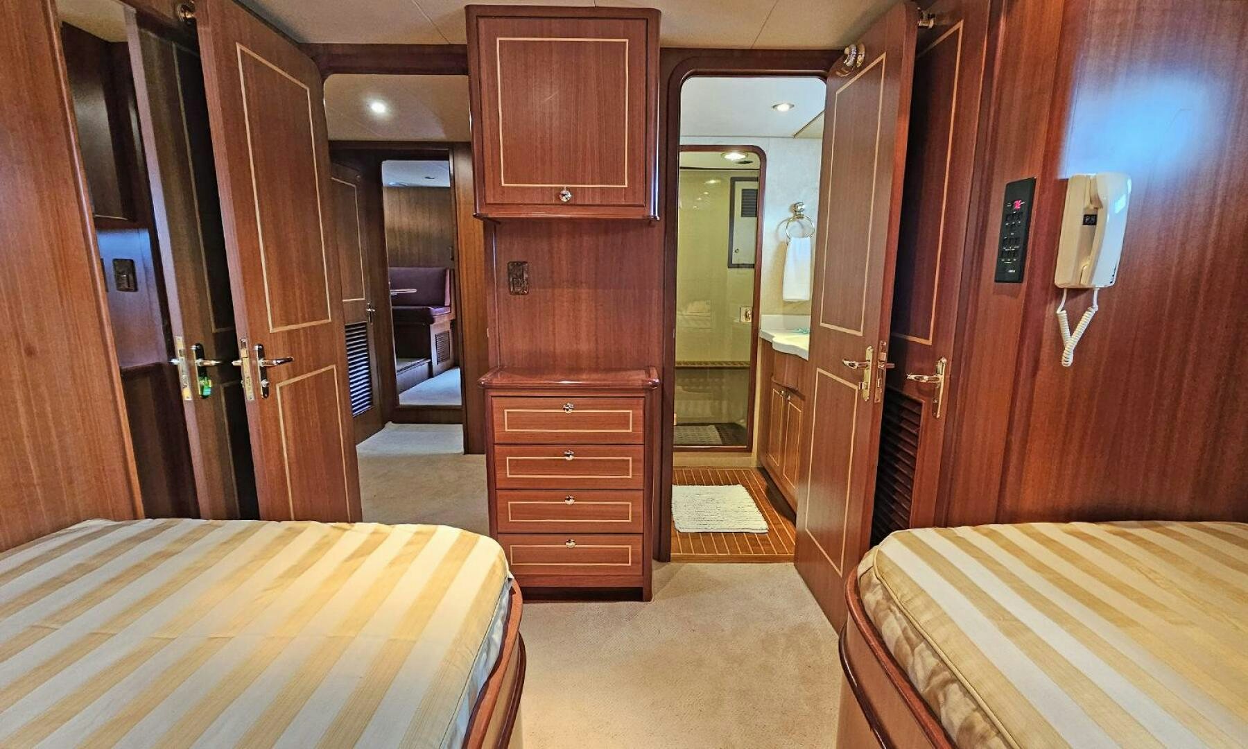 a room with a bed and a closet aboard SHAMROCK Yacht for Sale