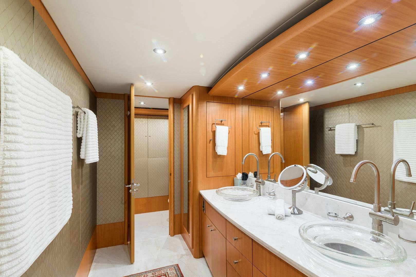a bathroom with a large mirror aboard SERENITY Yacht for Sale