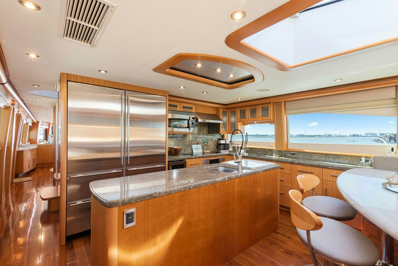a kitchen with a large glass shower aboard SERENITY Yacht for Sale