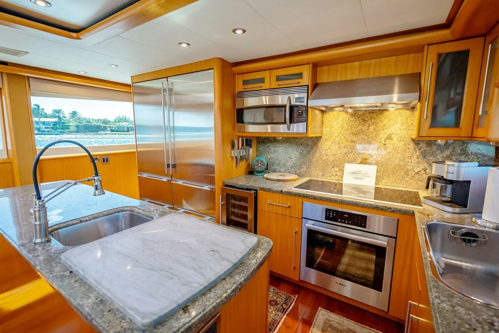 a kitchen with a sink and stove aboard SERENITY Yacht for Sale
