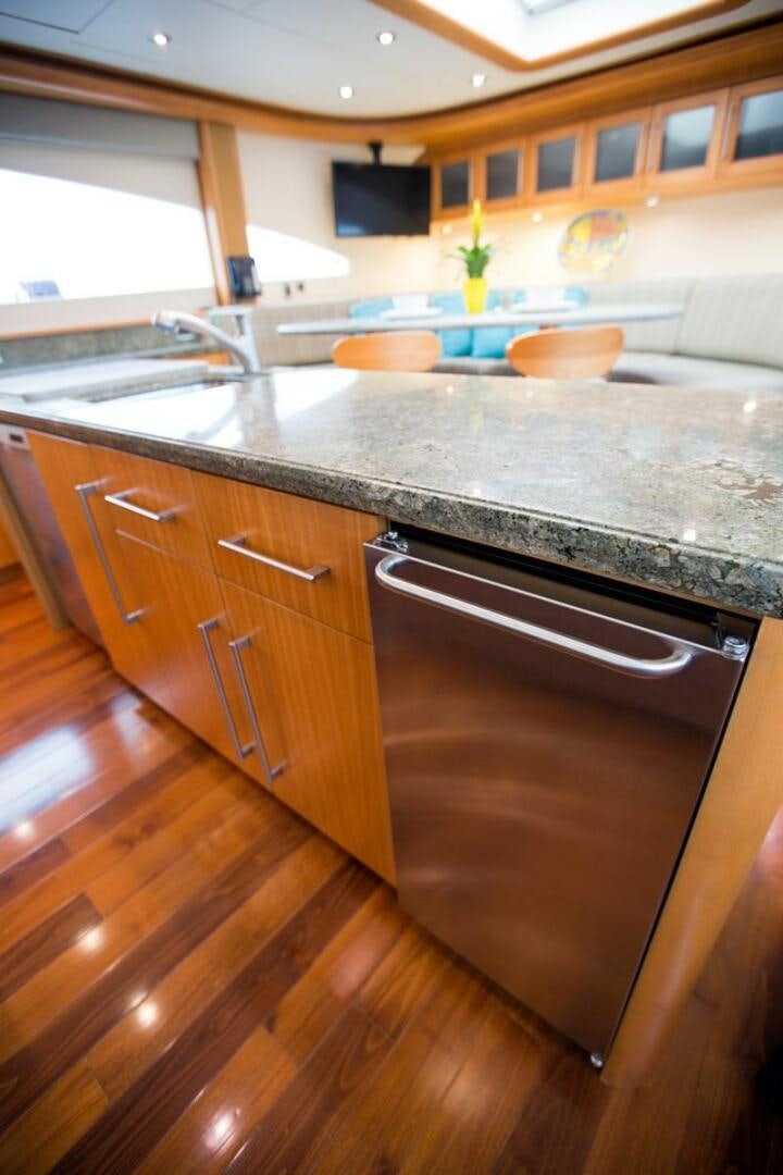 a kitchen with a stainless steel sink aboard SERENITY Yacht for Sale