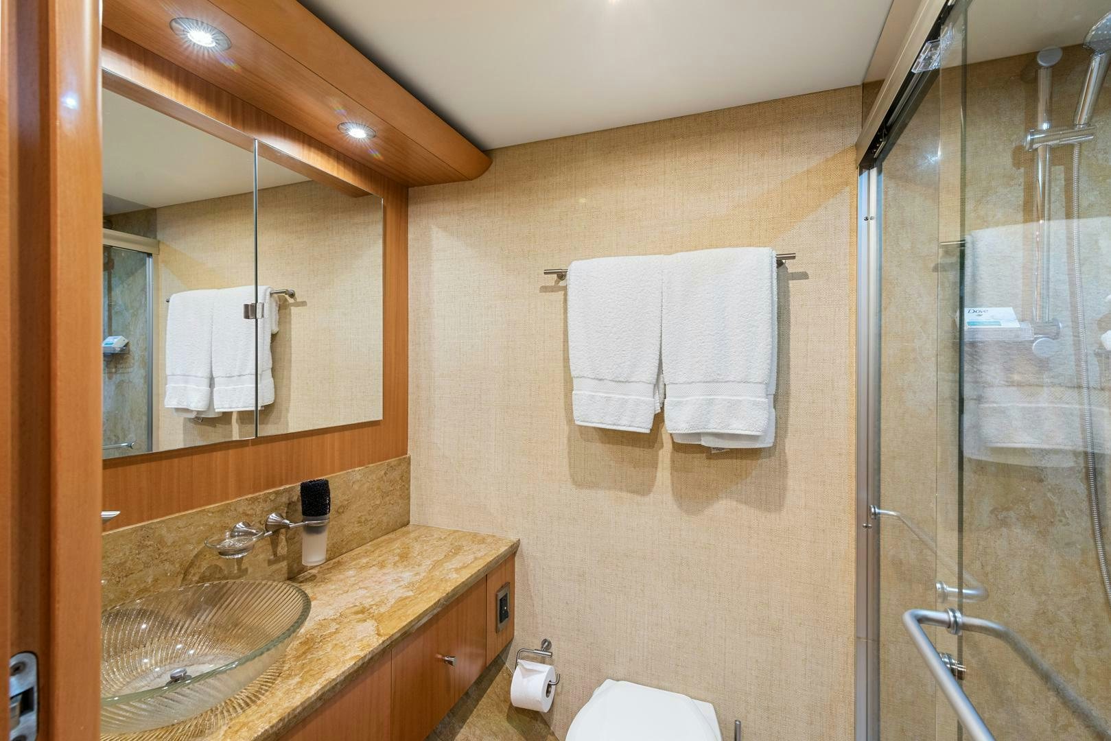 a bathroom with a sink and a mirror aboard SERENITY Yacht for Sale