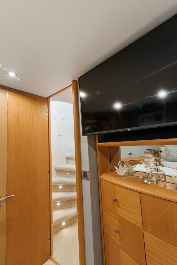a room with wooden cabinets aboard SERENITY Yacht for Sale