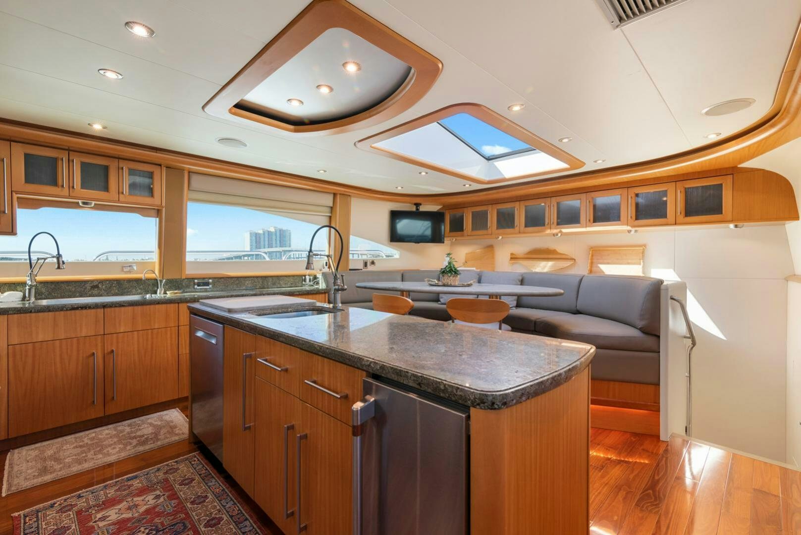 a kitchen with a large island aboard SERENITY Yacht for Sale